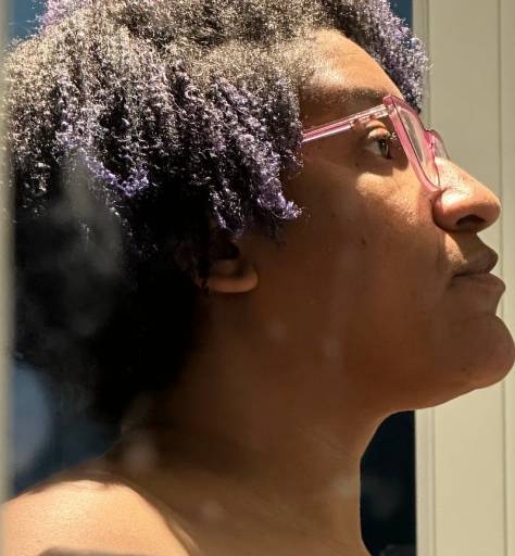 Kristen’s right side of her head, tilted up with a light hitting her nose